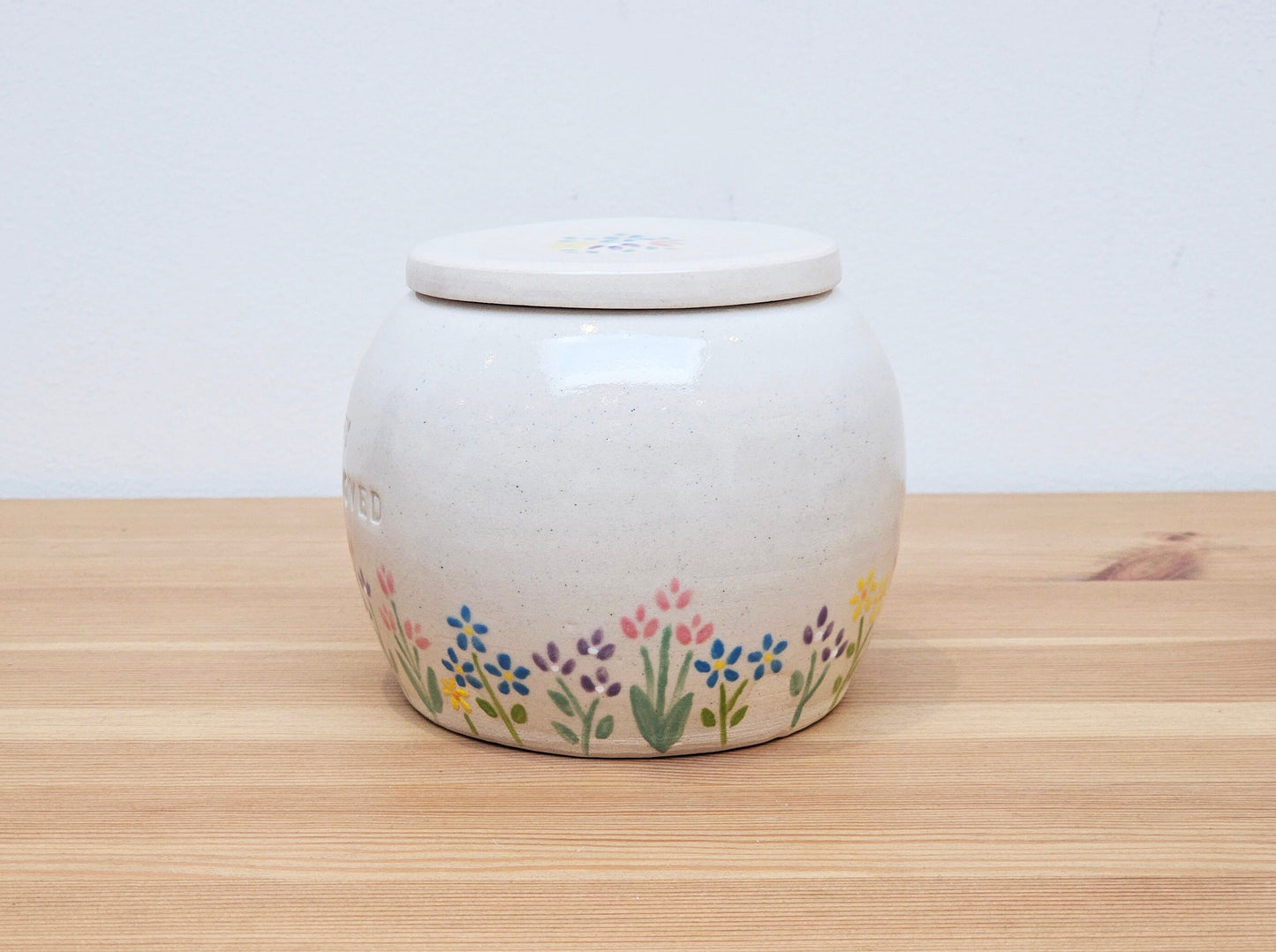 Personalised handmade ceramic pet urn with floral Garden Blossom design – custom memorial urn for dog, cat, or small pet ashes.