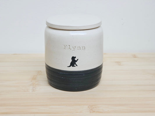Custom Pet Urn with 'Flynn' and a dog silhouette on the personalised urn.