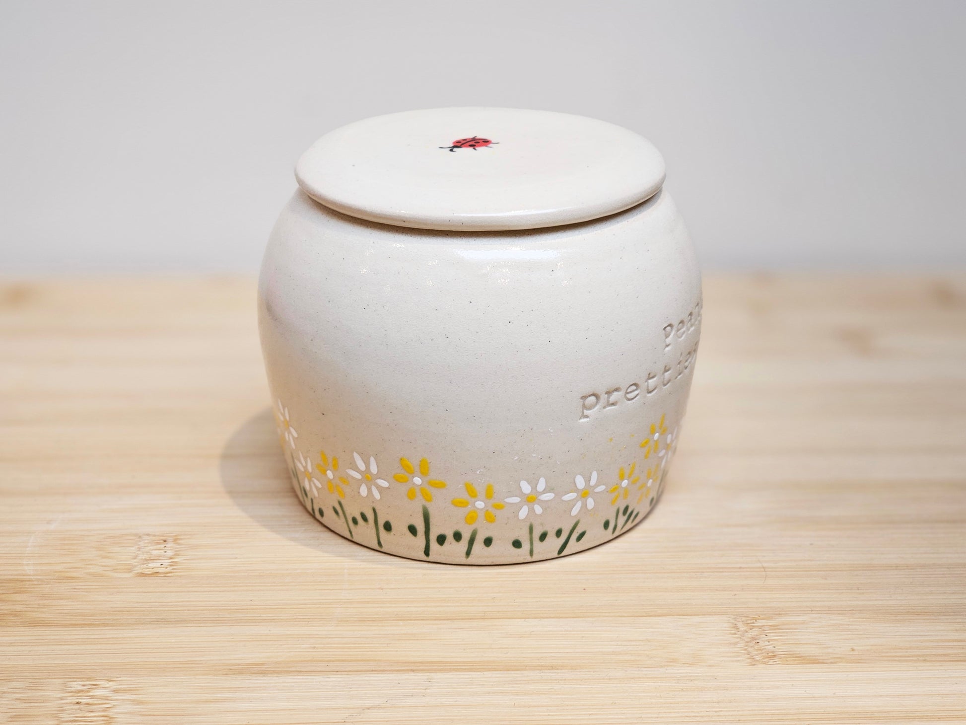 Hand-painted daisy and ladybug design pet urn, custom ceramic memorial urn for dogs and cats