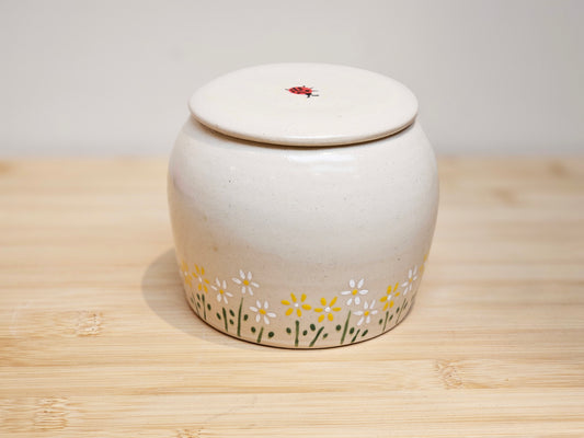 Custom daisy flower pet urn for dog or cat ashes, handcrafted pottery keepsake with ladybug design
