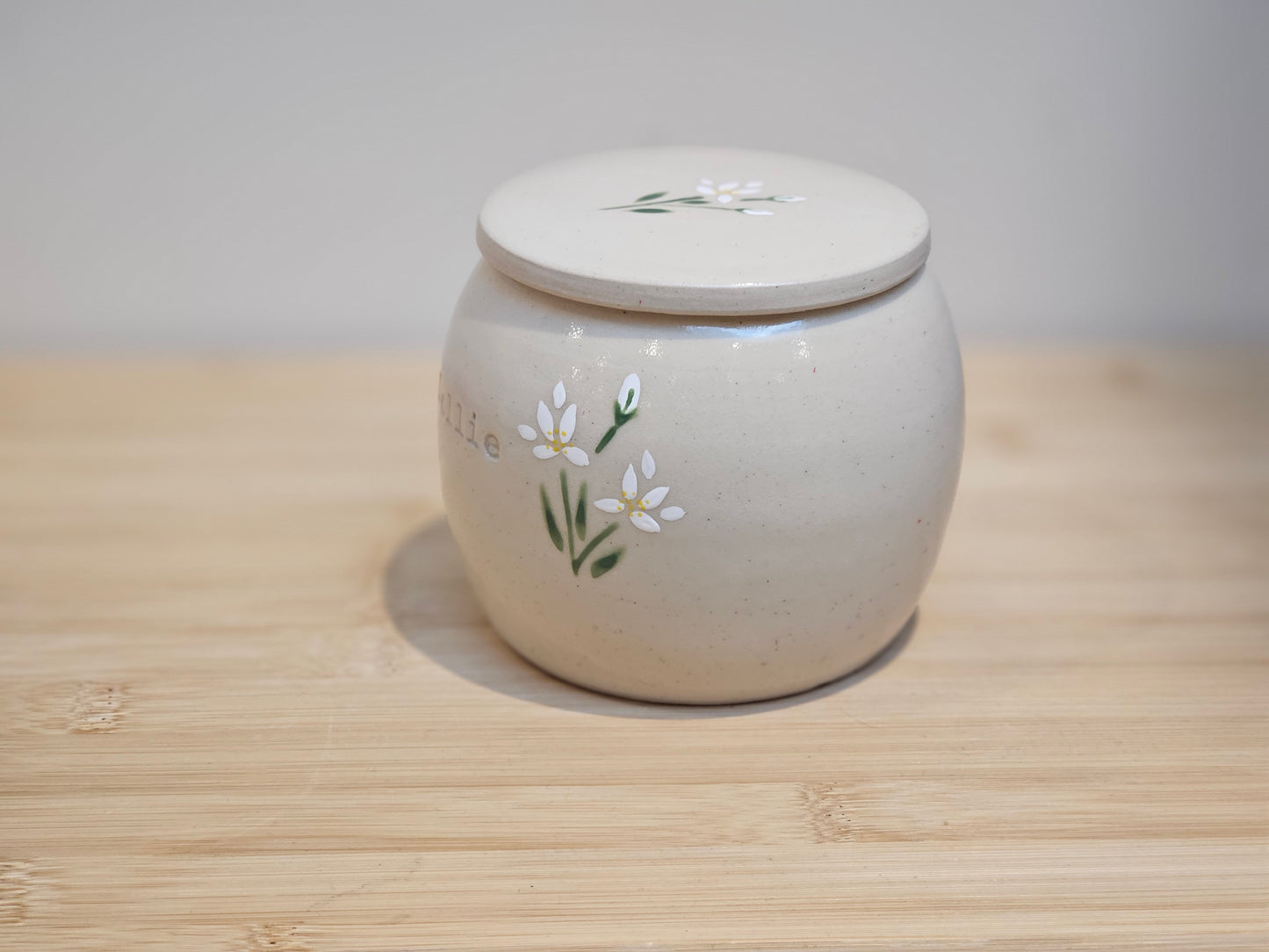 White lily dog memorial urn made from handmade ceramic pottery, UK artist