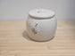 White lily dog memorial urn made from handmade ceramic pottery, UK artist